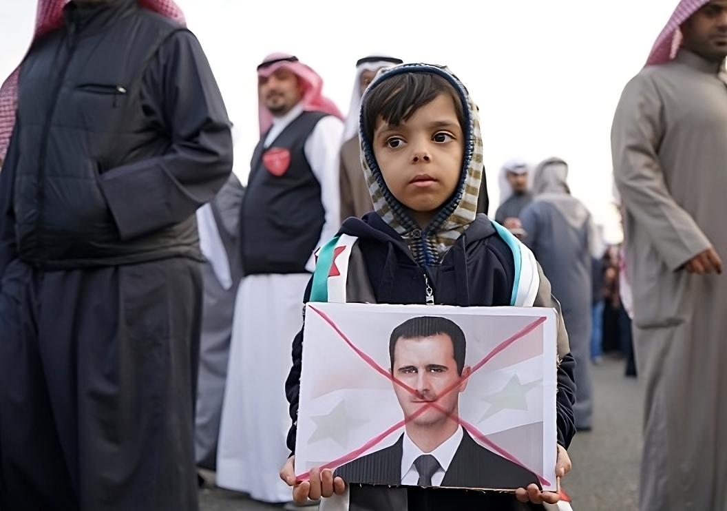 Child with Assad photo