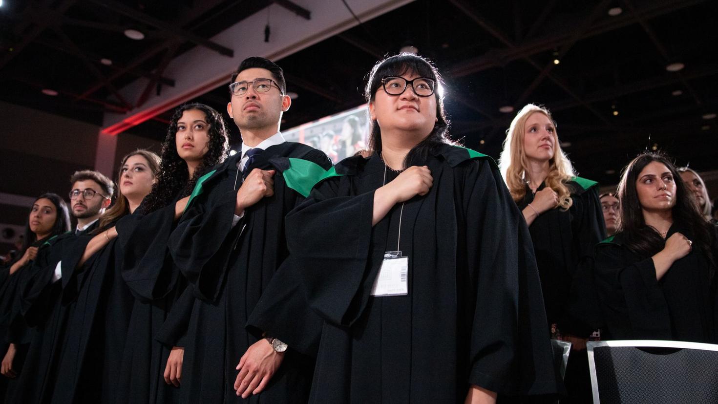 Graduates take an oath of professional engagement during the 2023 Convocation