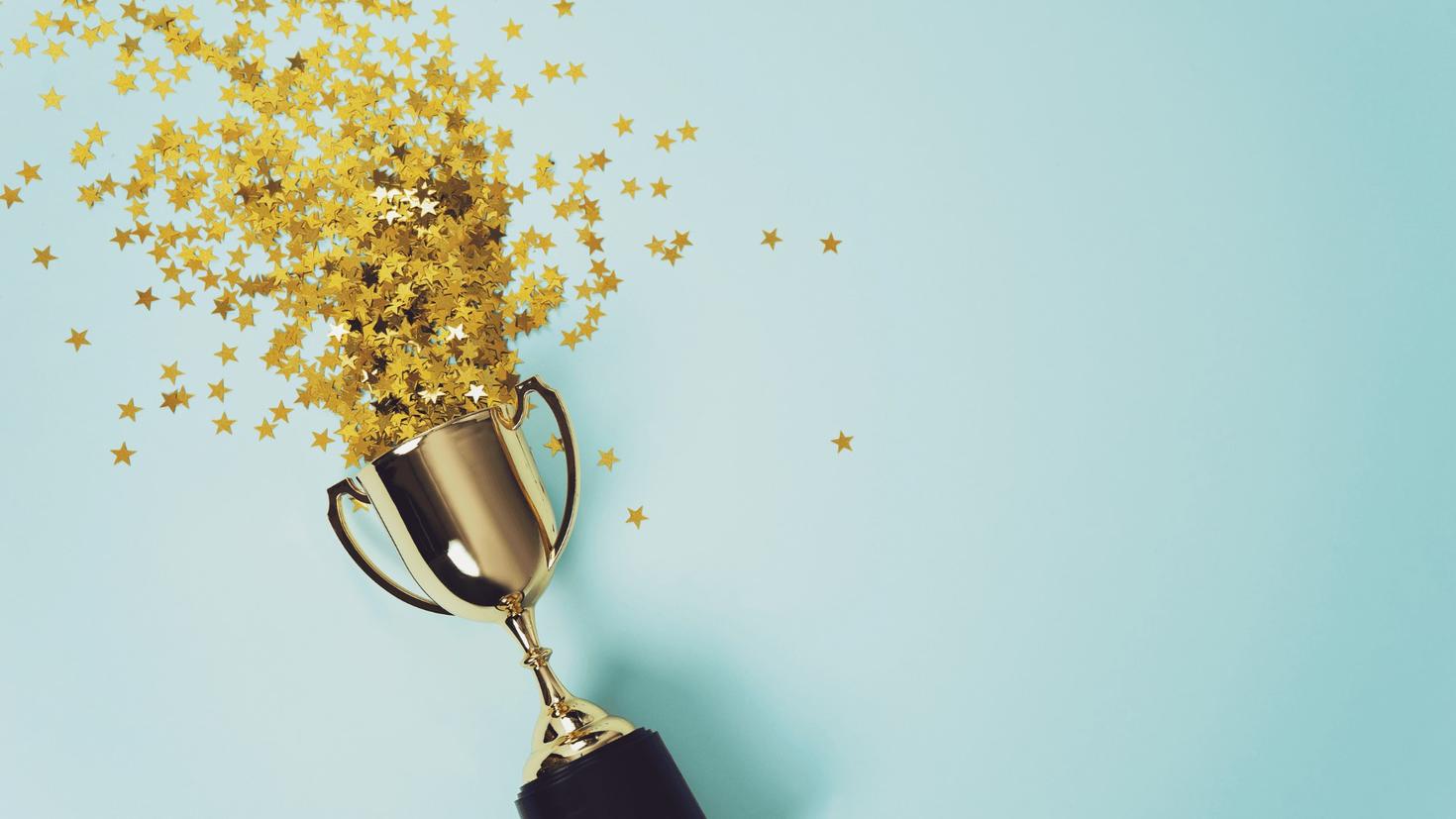trophée explosant avec des étoiles d'or