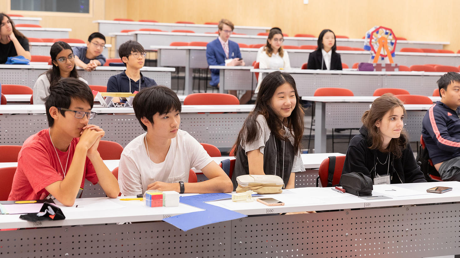 Students in classroom listening to presentation.