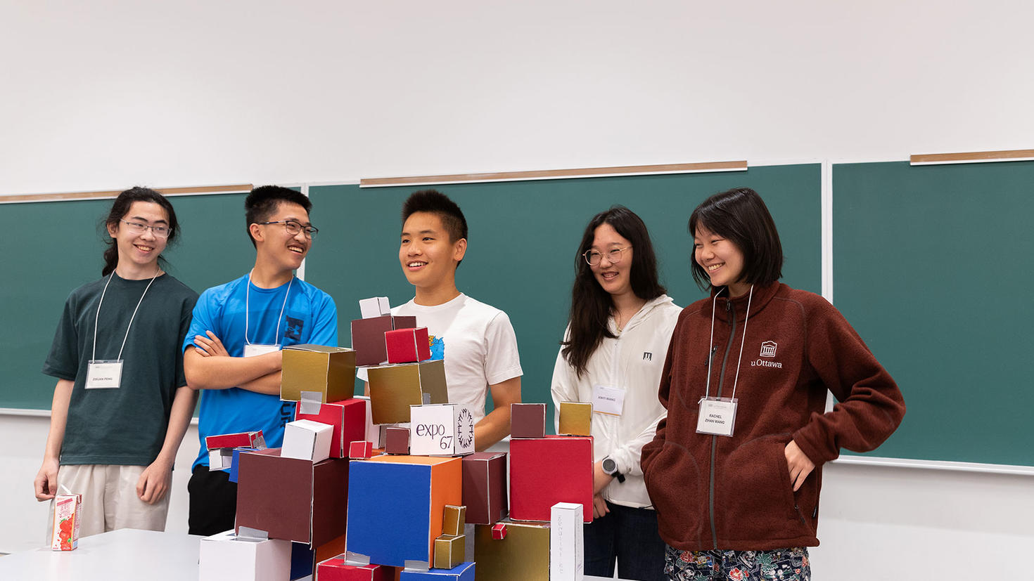 Math camp students showcasing their projects.