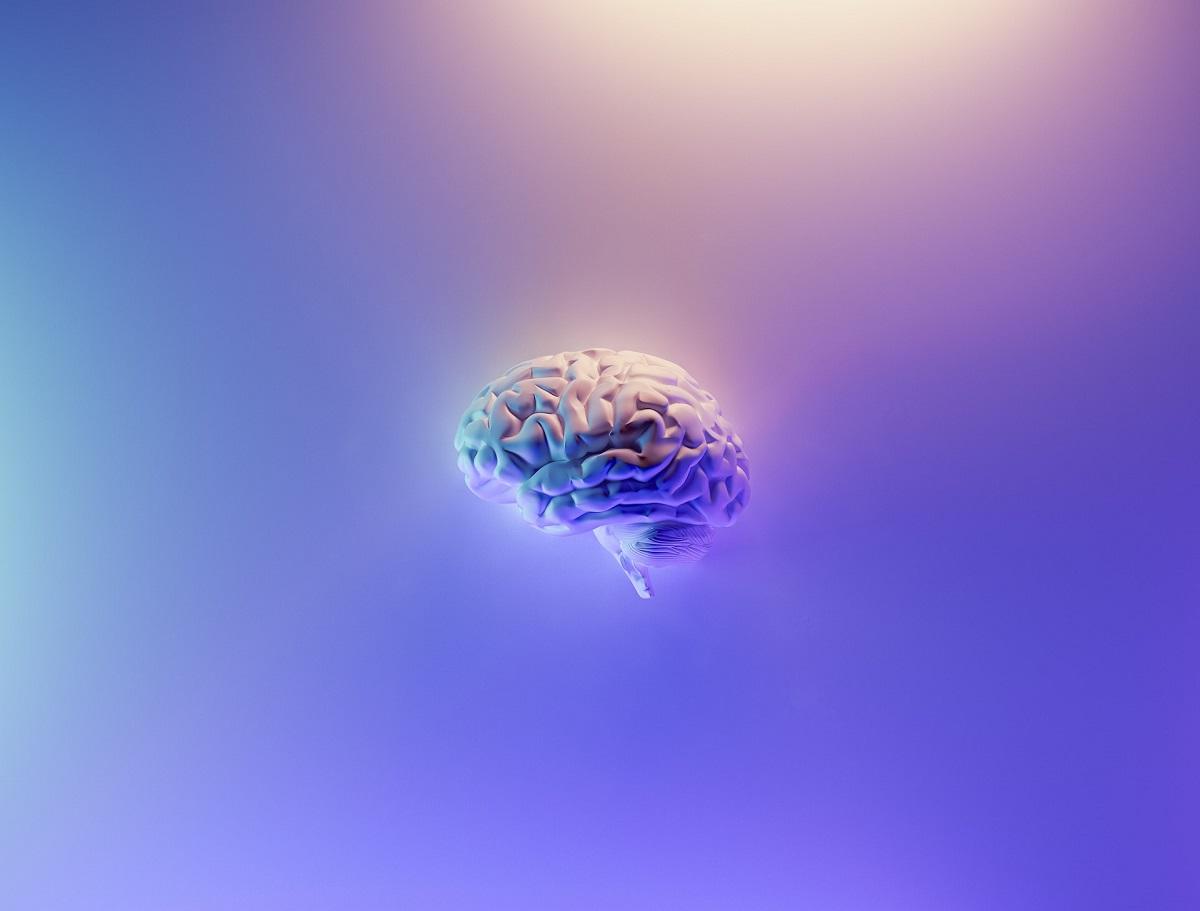 Floating brain amid purple backdrop