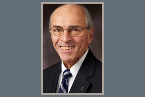 Image of Michael T Richard on a blue background and grey frame.