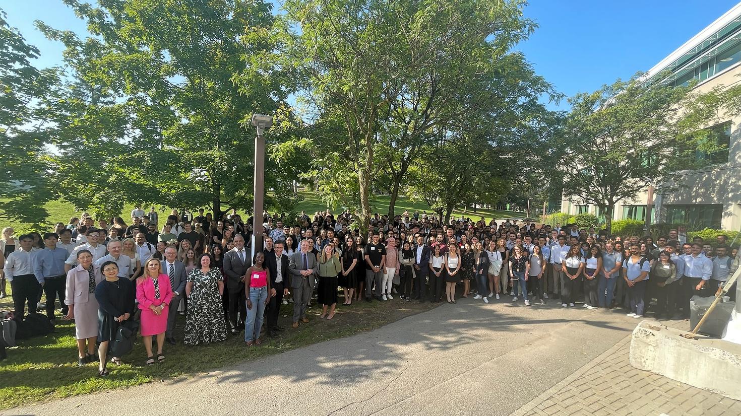 People standing under the trees