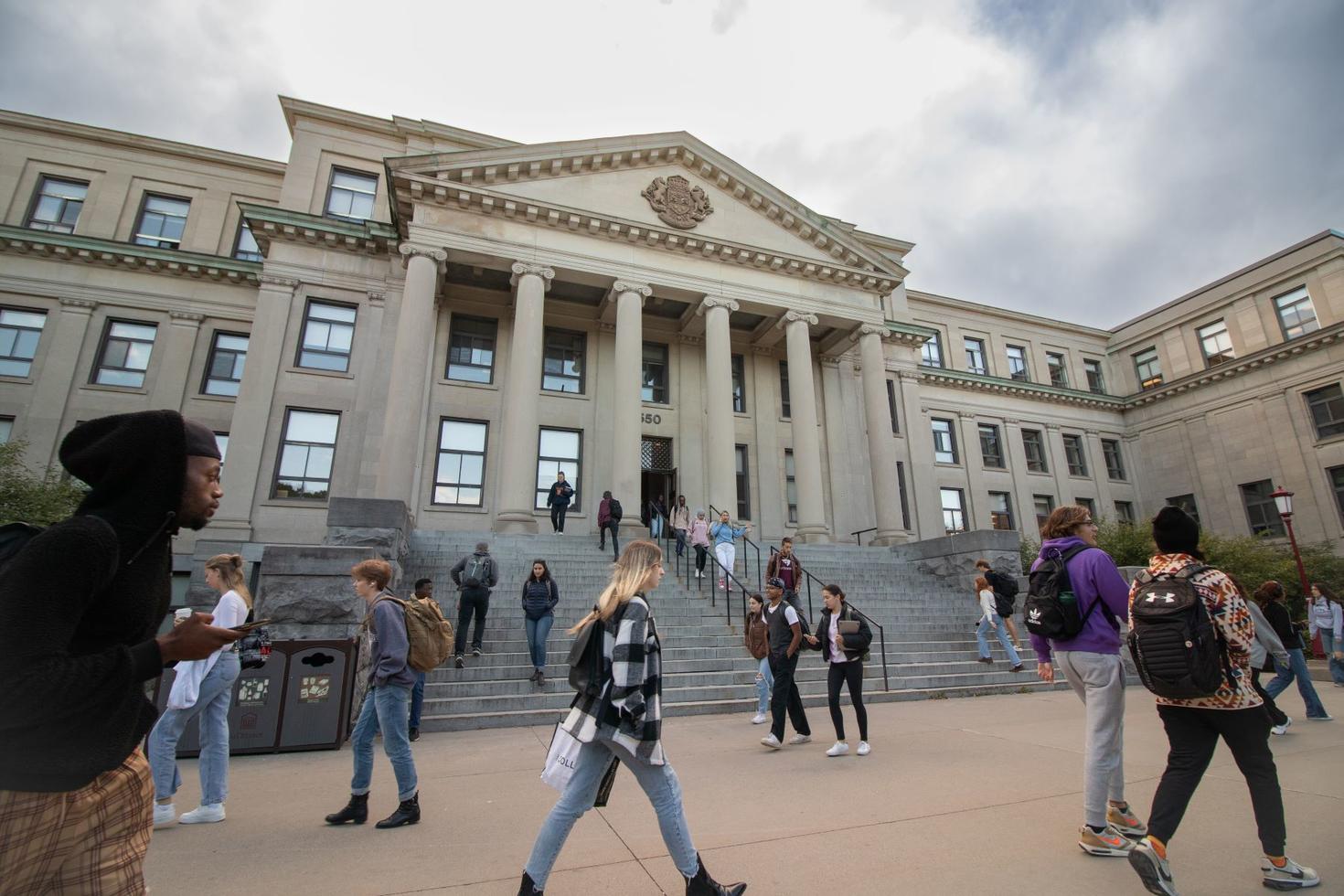 students walking in front of tabaret hall