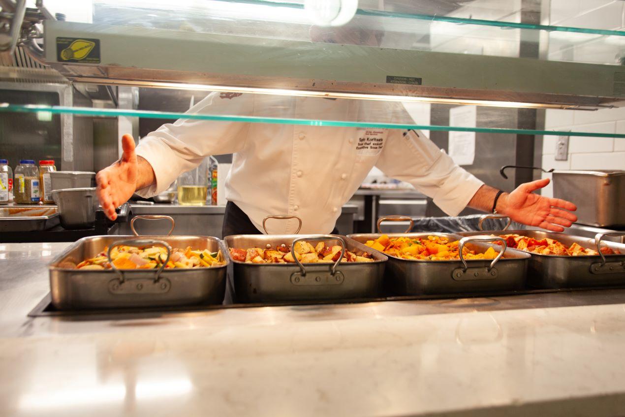 Serving trays filled with hot food in the Dining Hall