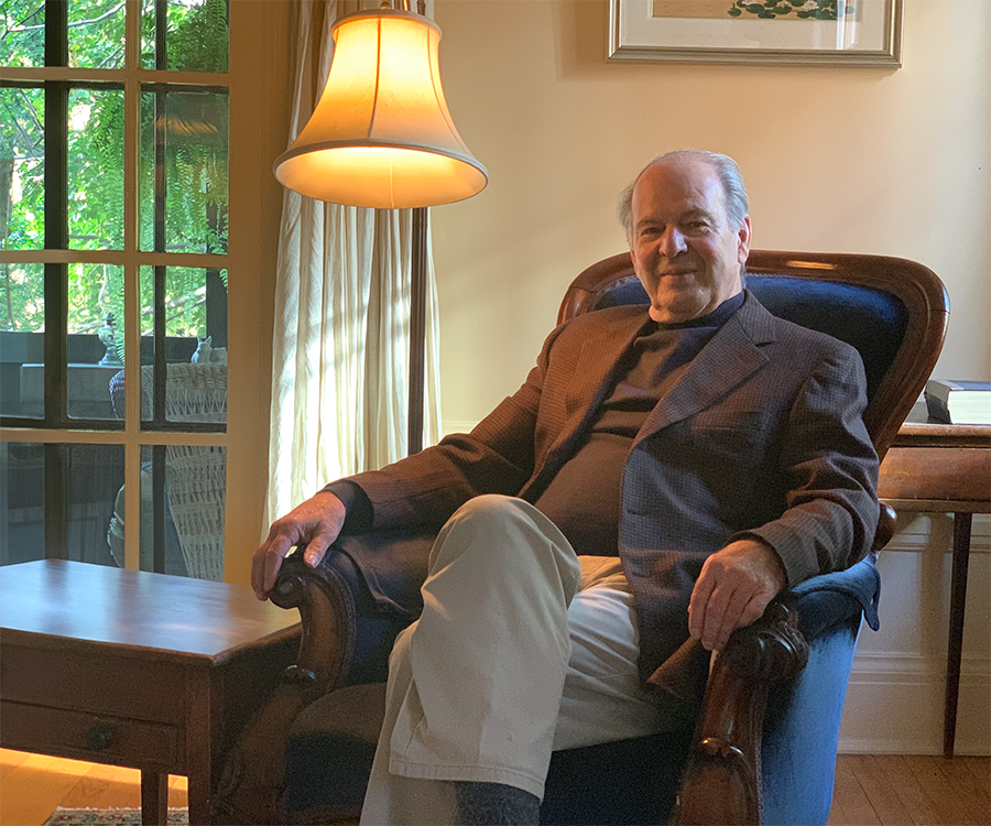 Dr. Pierre Morisset sitting in a chair at home
