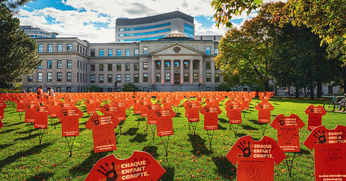Orange shirt signs cover Tabaret Lawn