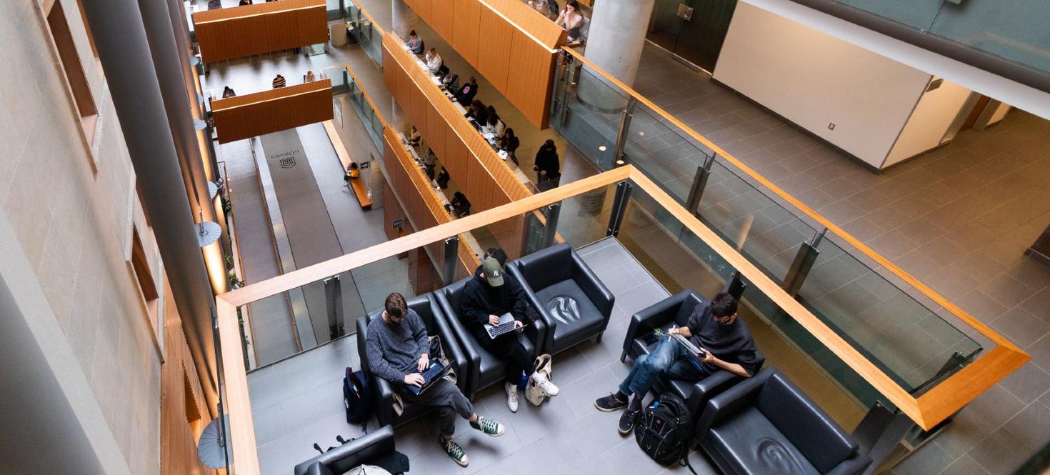 Students studying inside the Faculty of social sciences building