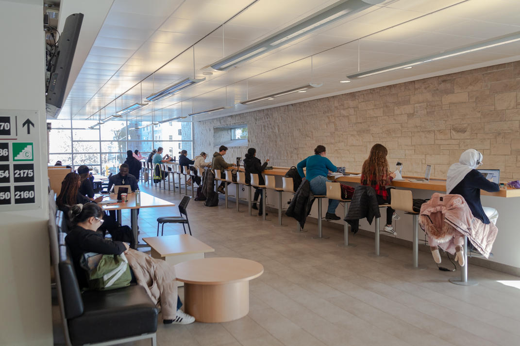 Students studying inside Desmarais Hall