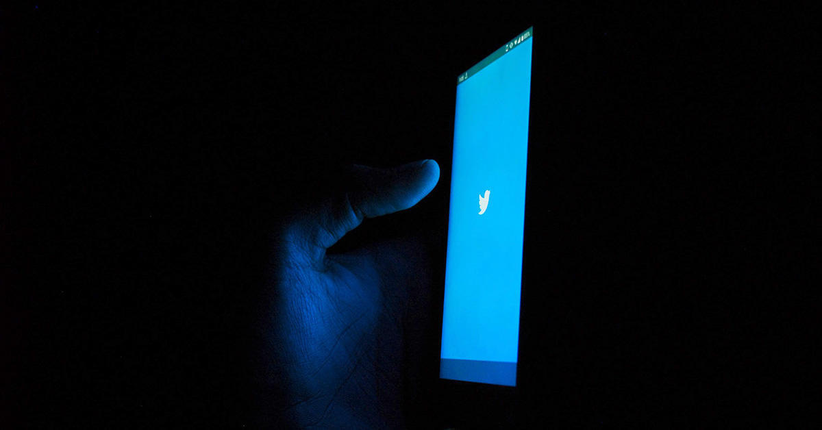 A hand holding a phone 