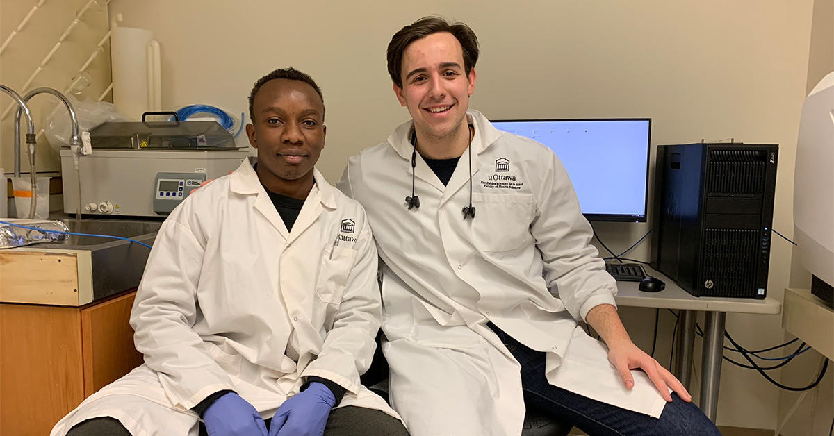 Landry Kalembo (left) and research colleague Dejan Bojic (right) completing data analysis in a lab at Roger Guindon Hall.