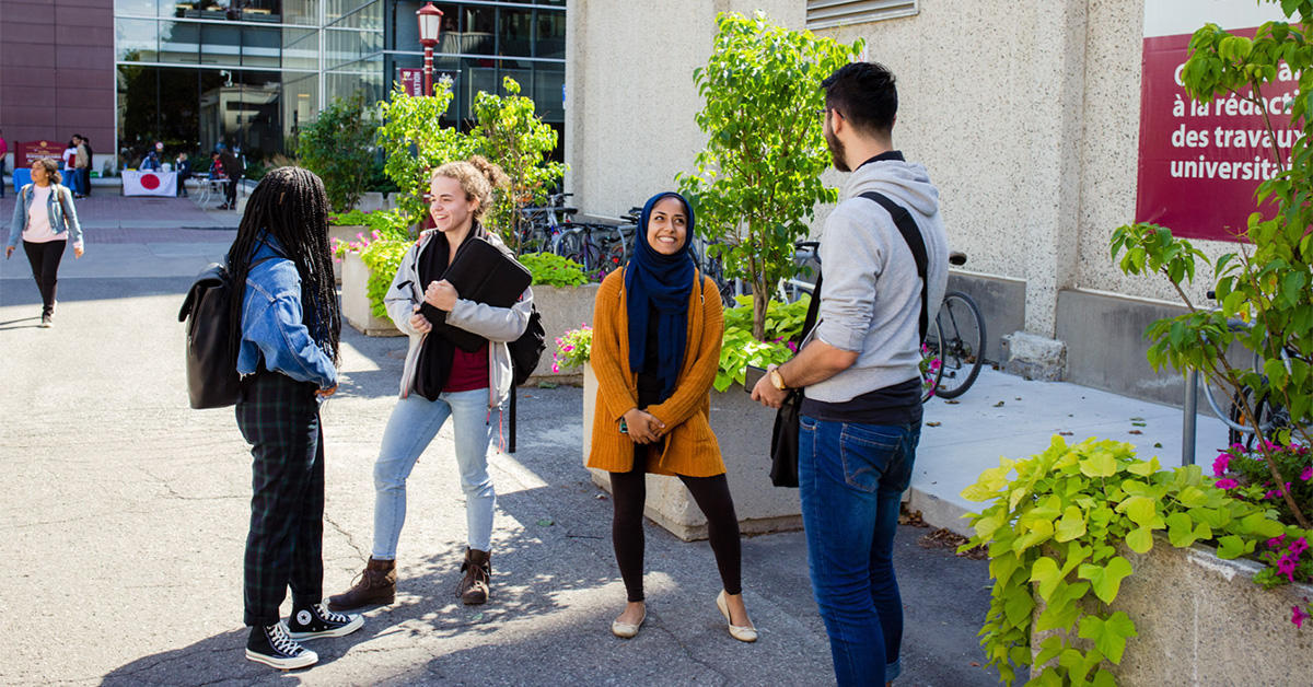 Students talking outside on campus