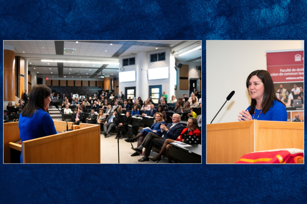 A woman stands at the podium in front of a classroom full of spectators