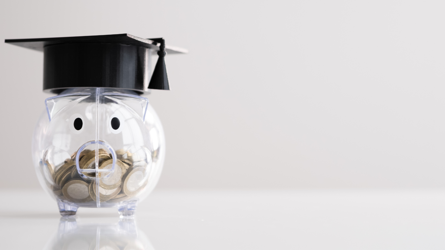 Piggy bank with graduate hat