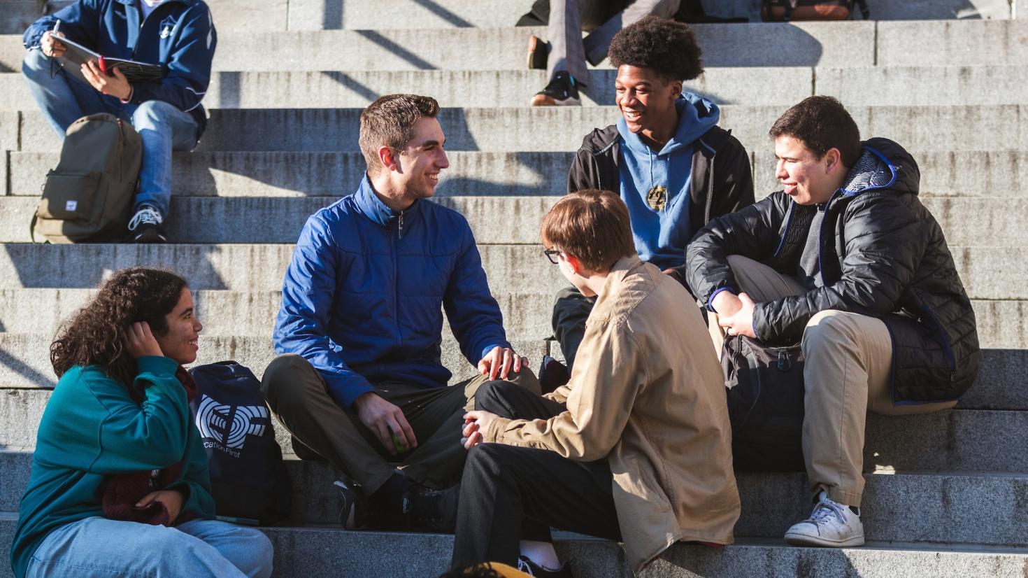 Students on steps, talking