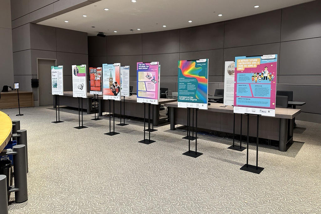 Students' posters stand on display at Ottawa City Hall
