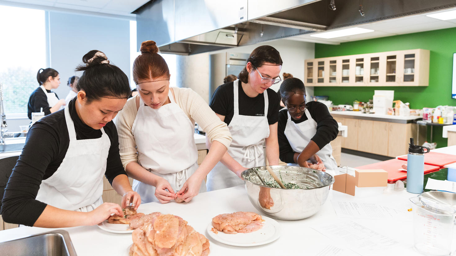 Students of the Faculty of Health Sciences Nutrition program prepare food in the Nutrition labs for an event celebrating the labs opening