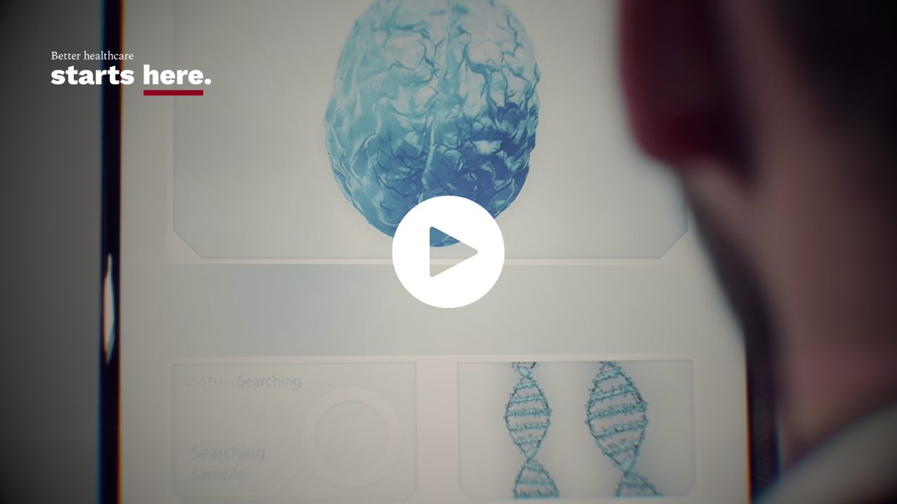 View over the shoulder of a person, looking at brain scan, with the tagline Better healthcare starts here