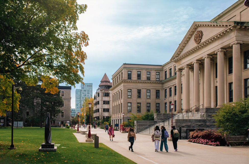 Students walking past Tabaret Hall