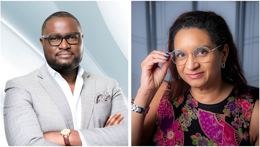 A man and woman wearing glasses, smiling at the camera.