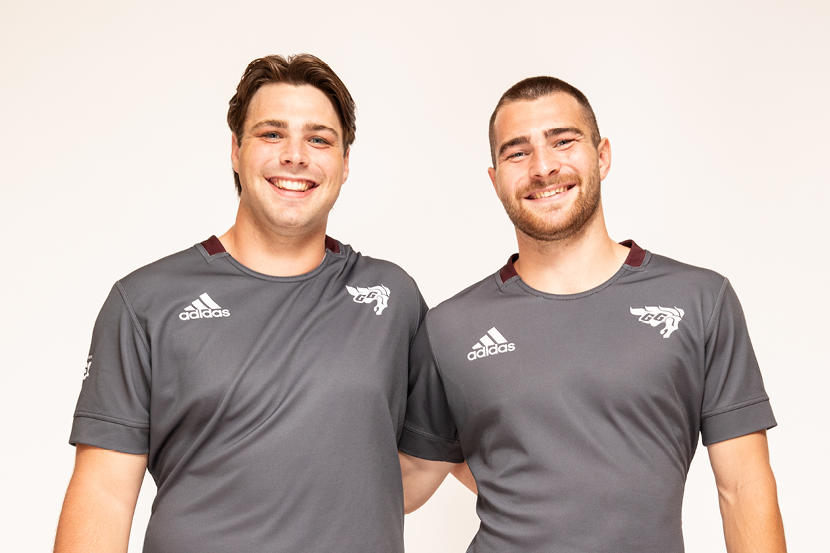 Brothers Evan and Glenn Roy proudly wear the team uniform.