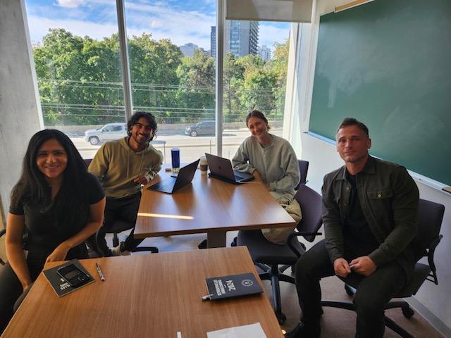 group of 4 students posing for a photo
