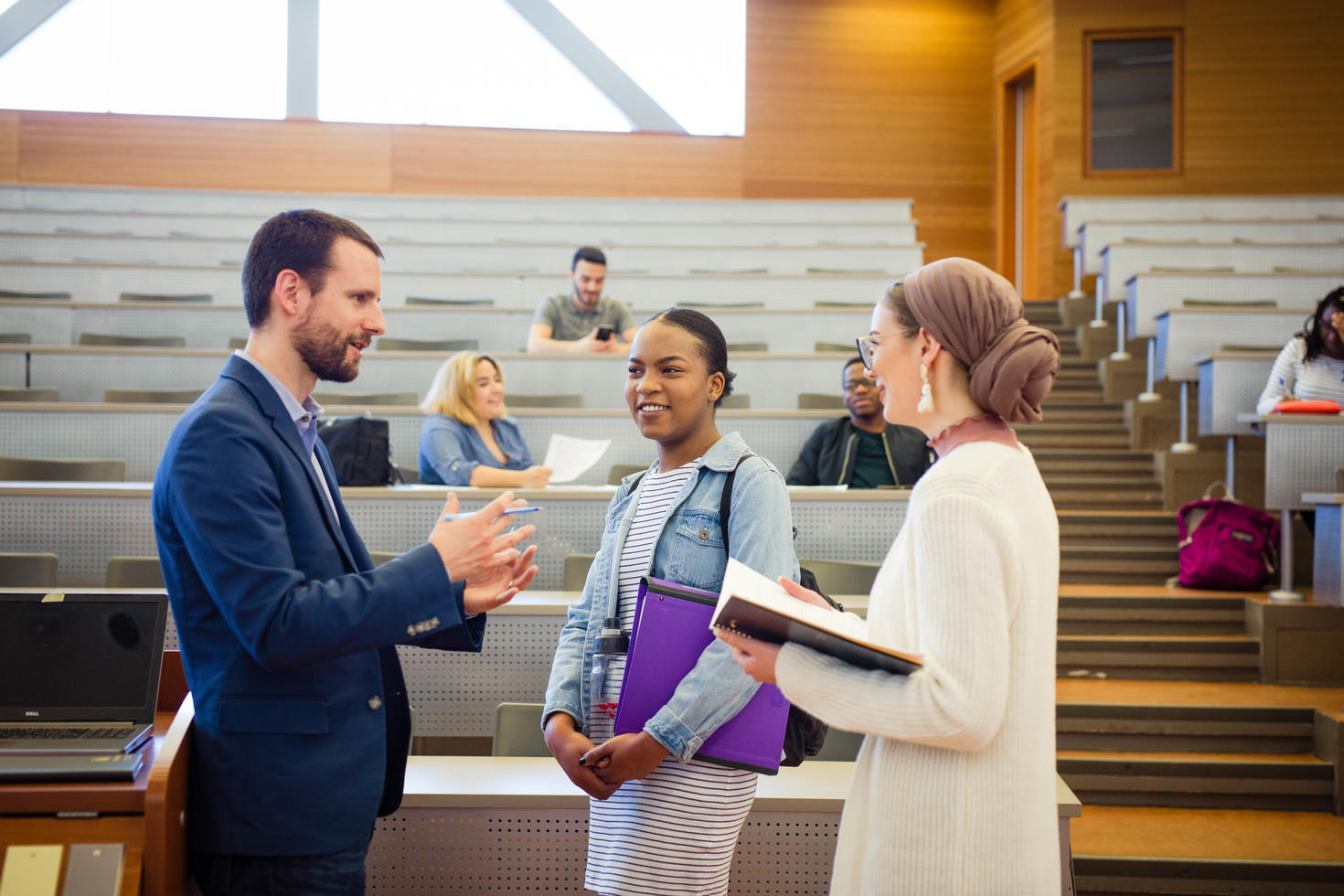 Two potential graduate students meeting with GSPIA professor Thomas Juneau