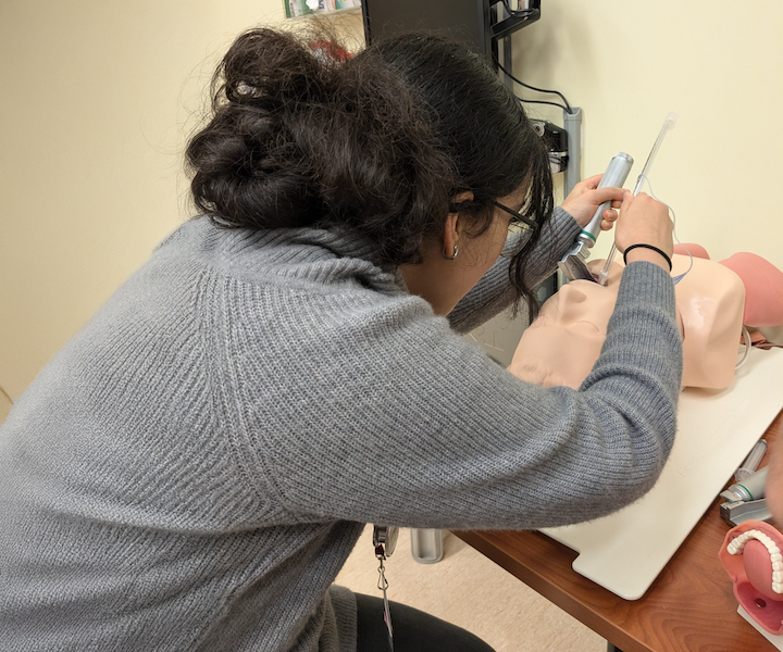 A student intubating a manikin.