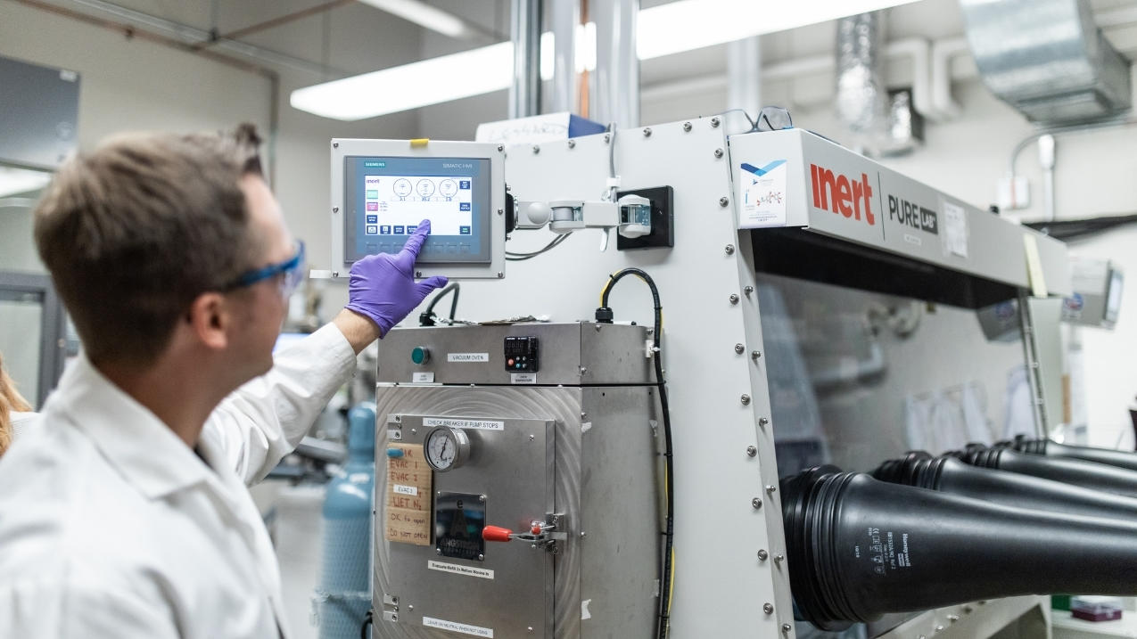 A chemical engineer using a machine.