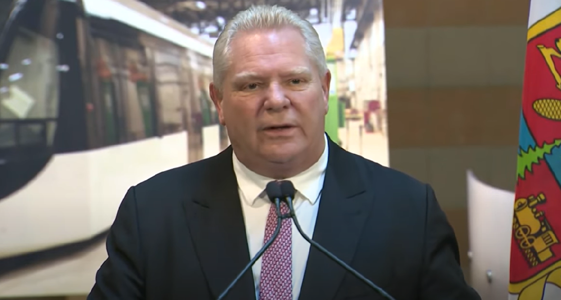 Doug Ford at a microphone