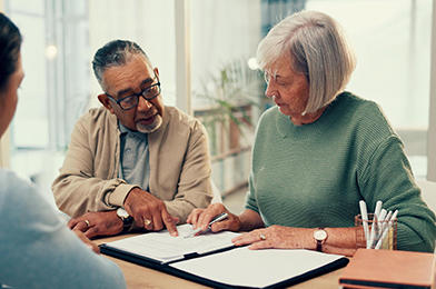 A couple reviewing estate with an advisor