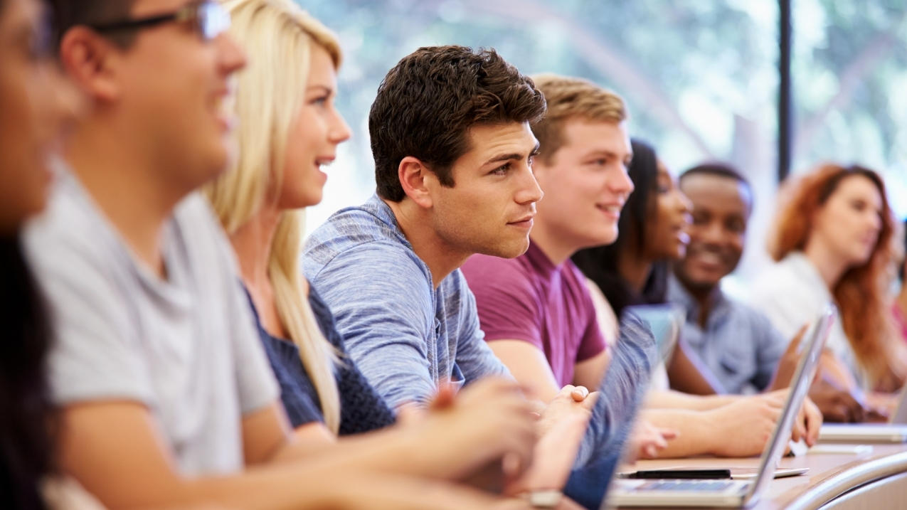 A group of people inside a classroom.