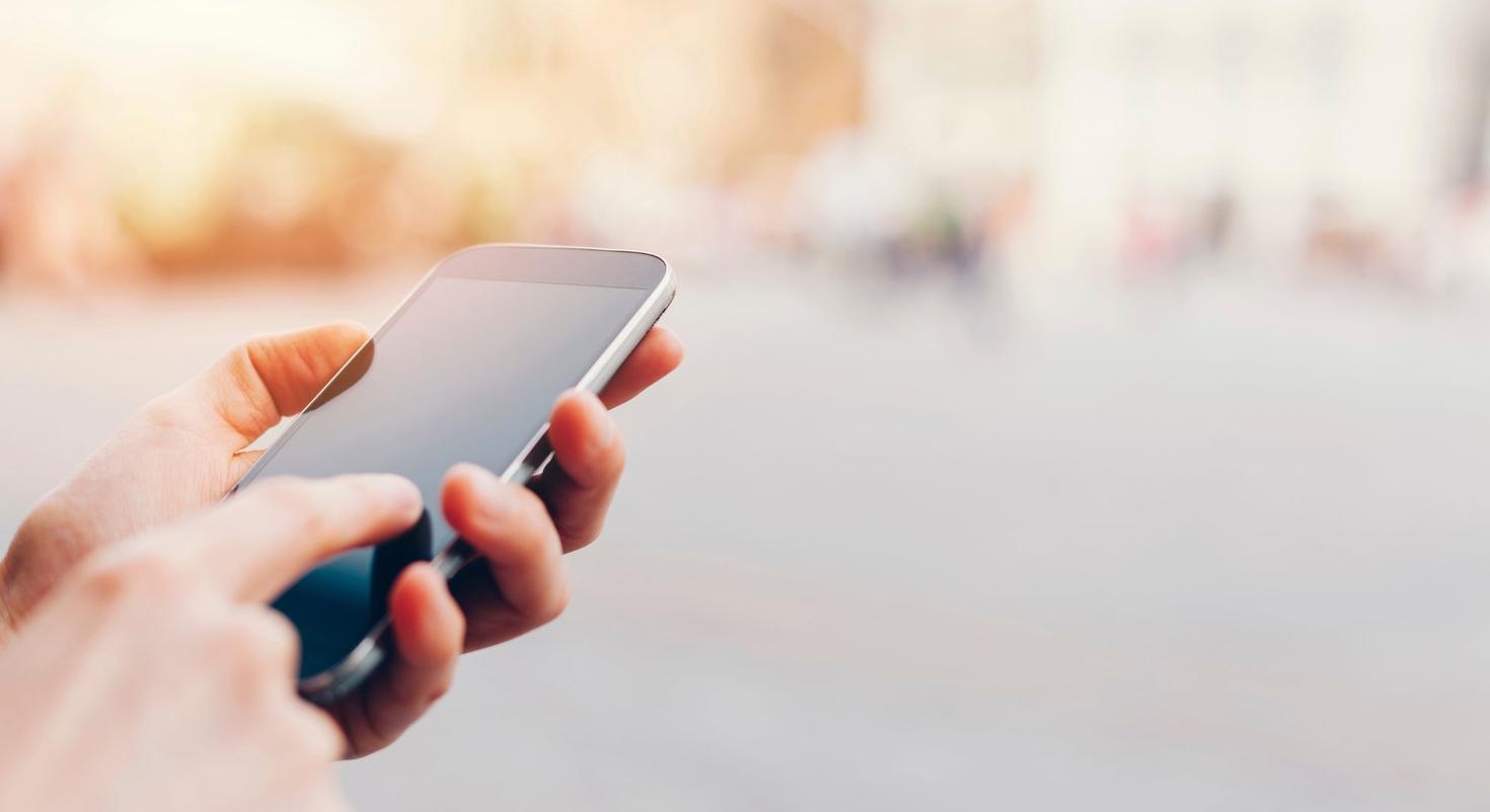 someone holding a phone in their hands 