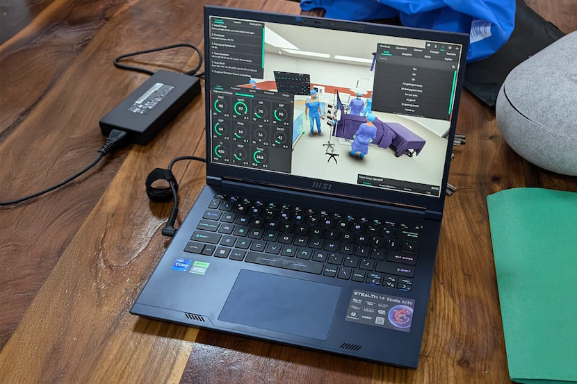 Un ordinateur portable sur un bureau, affichant de la réalité virtuelle à l’écran.