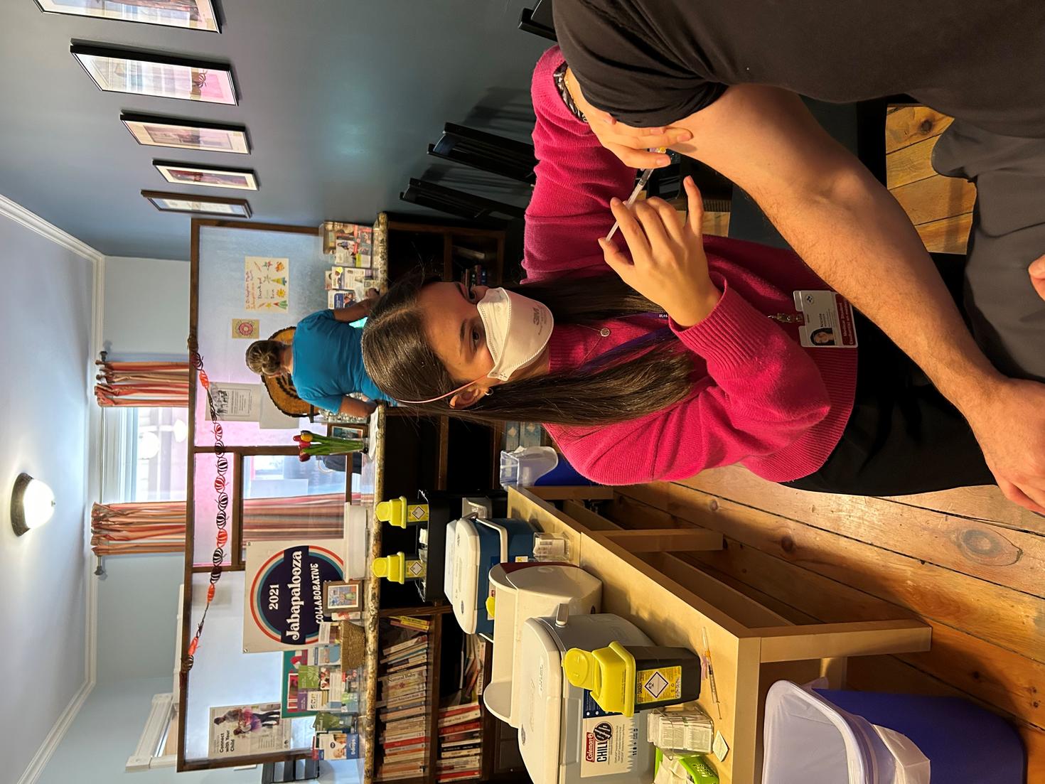 Student vaccinating a patient