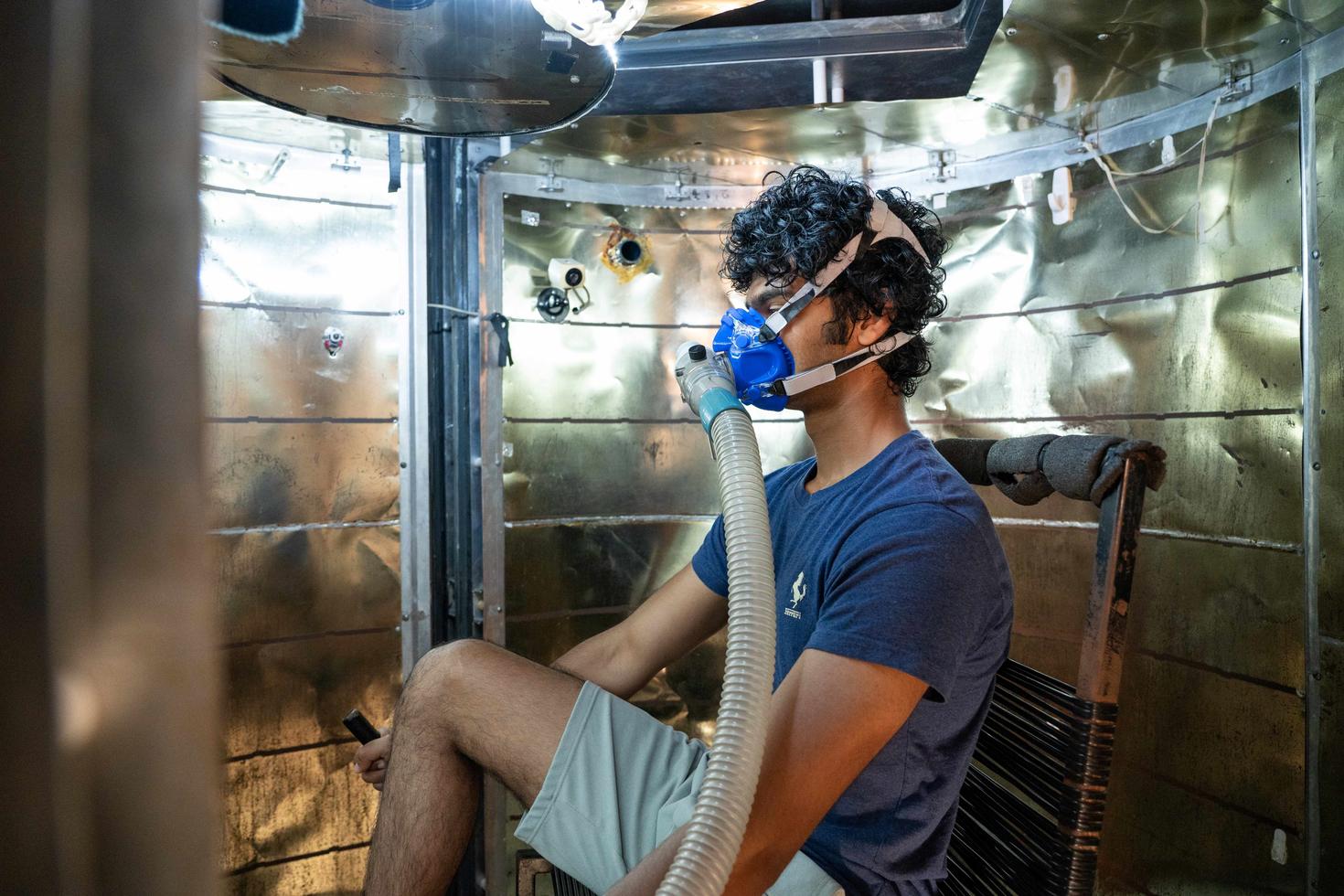 student in a lab with an oxygen mask on
