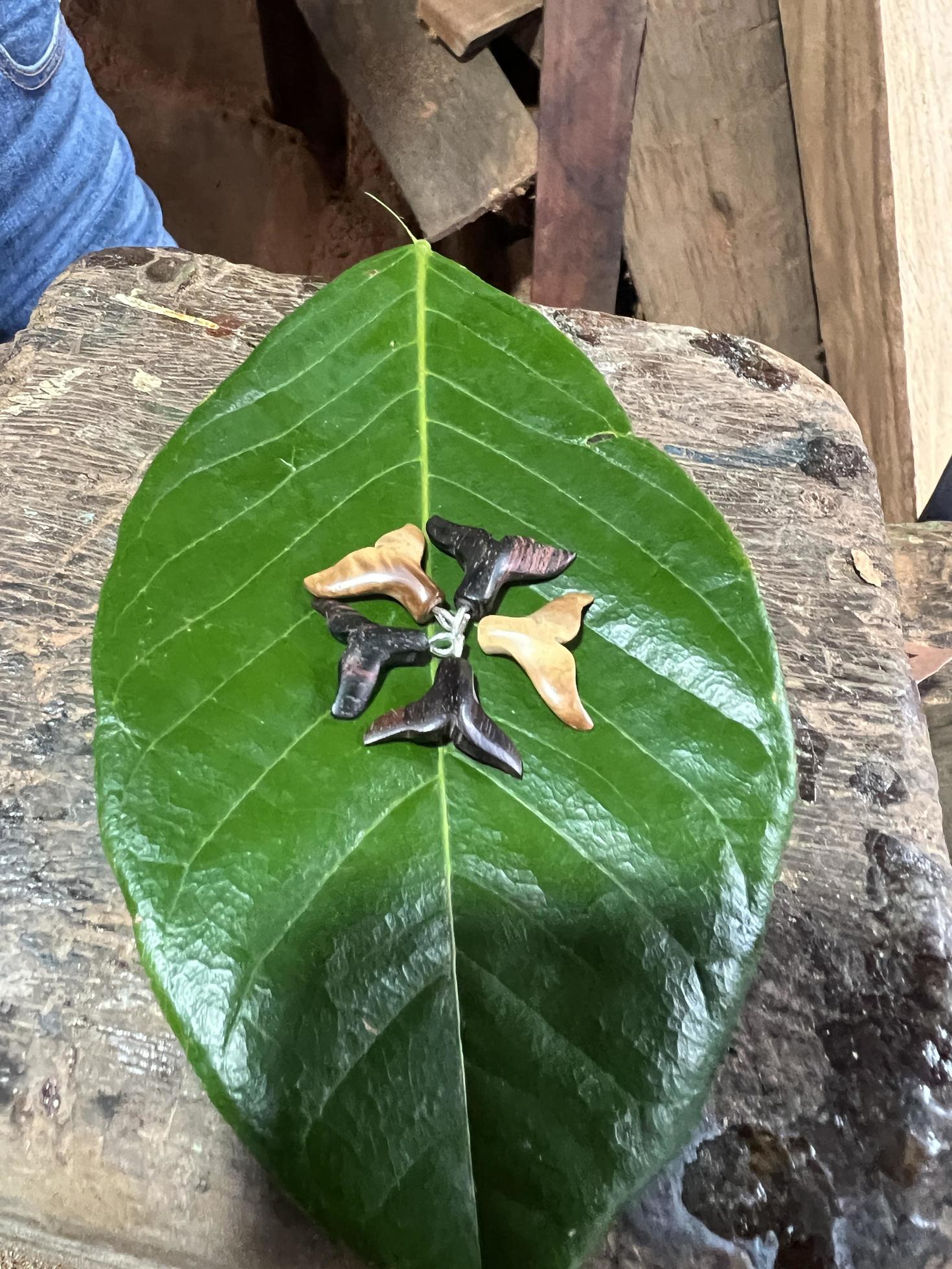 Tree leaf fitted with five artificial fish fins