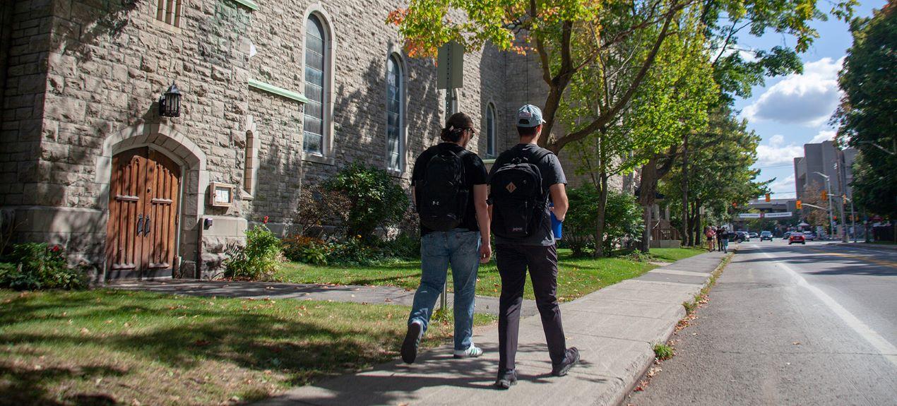 Two students walk past a church in the leafy Sandy Hill neighbourhood.