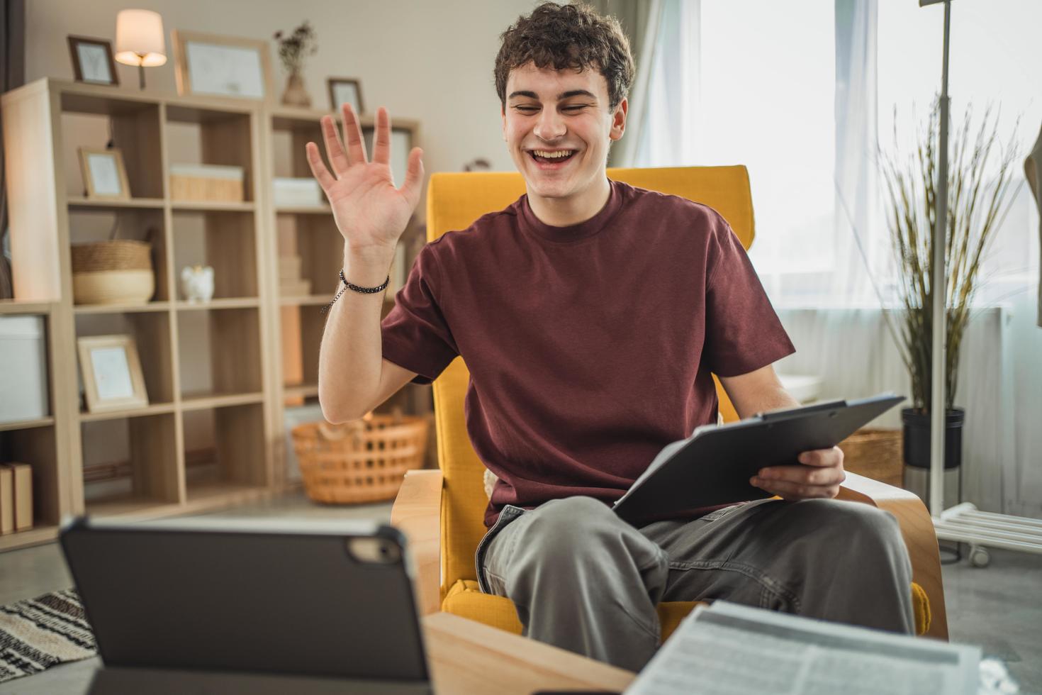 Student laughing in front of laptop