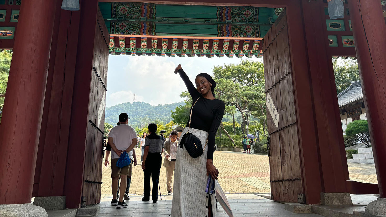 A student standing in front of a building in South Korea.