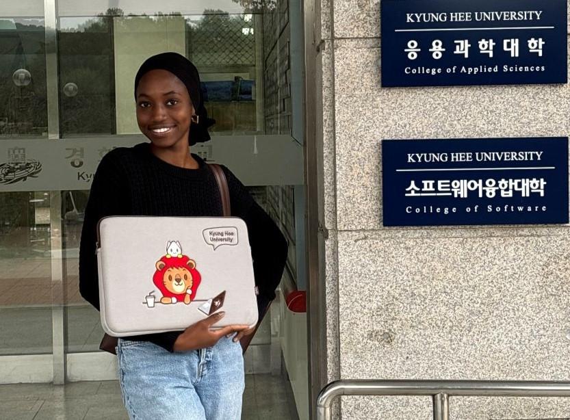 Fatimata in front of her university in South Korea.