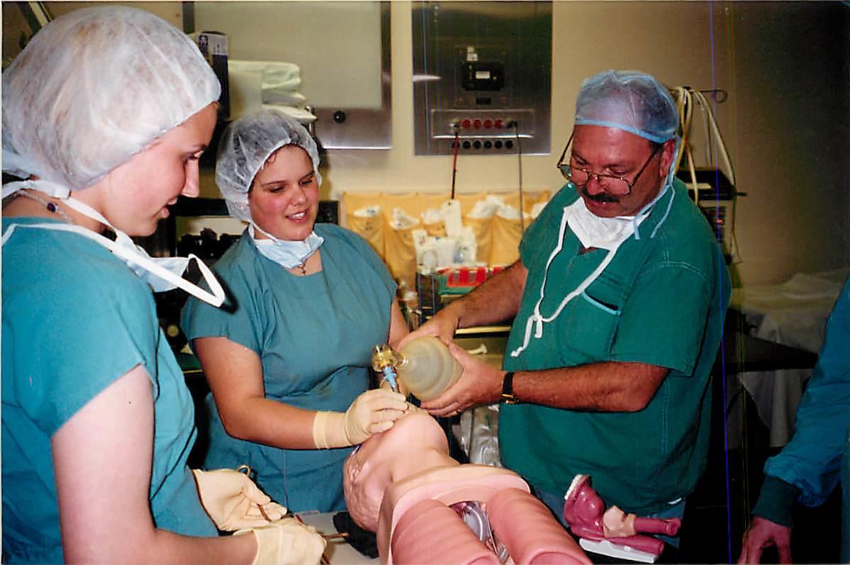 Dr. Jean Anawati teaching his students respiratory resuscitation using manual ventilation.