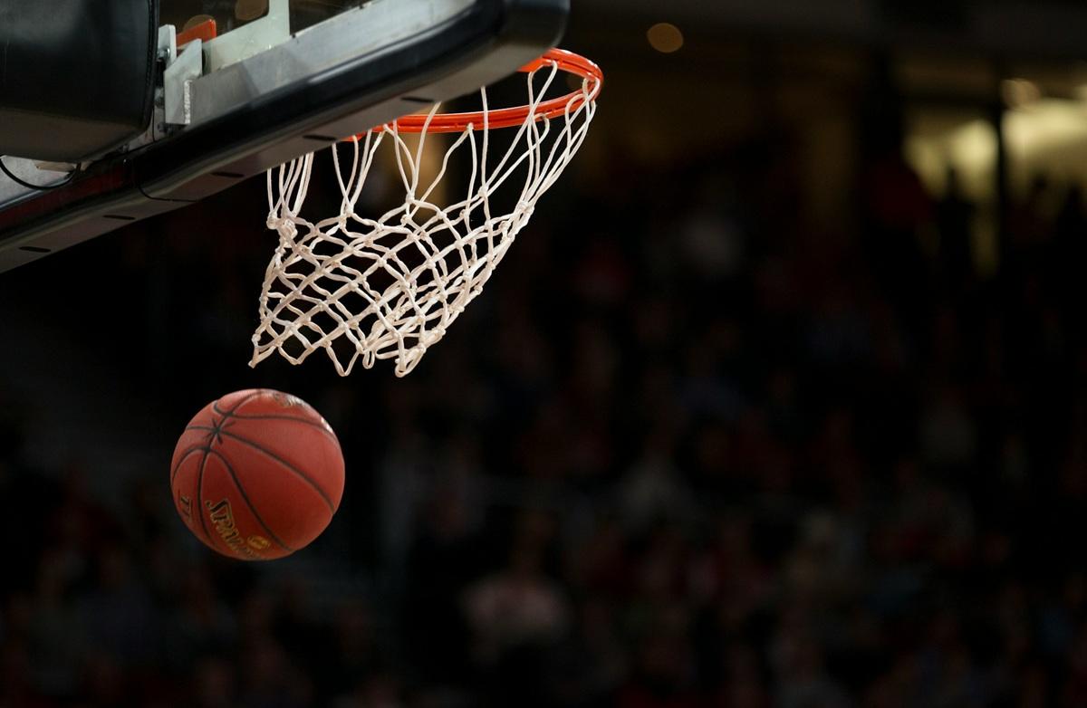 Basketball falls through hoop