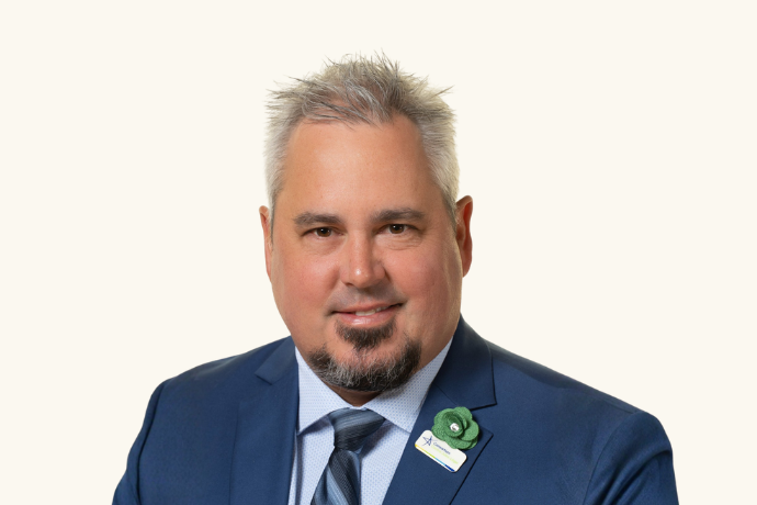 Portrait of a man with white hair and black beard