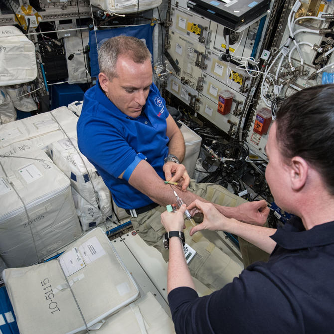 Astronaut giving blood