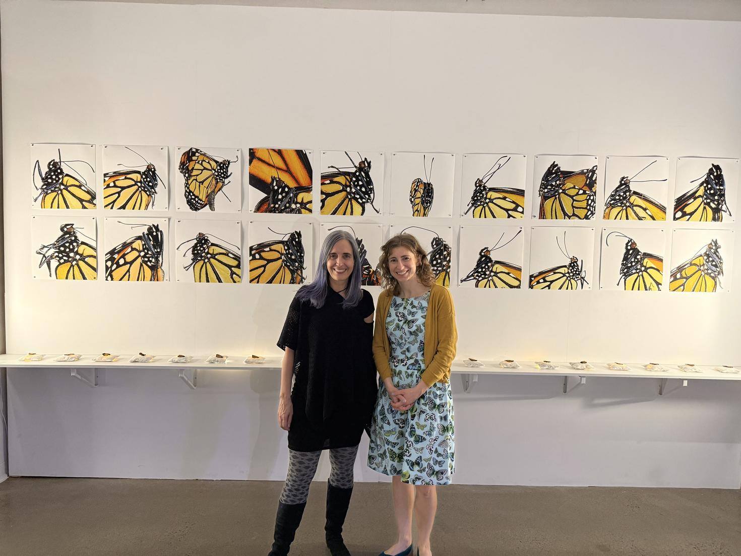 Valérie Chartrand (left) and Heather Kharouba (right) standing in front of the Flutterings exhibit.