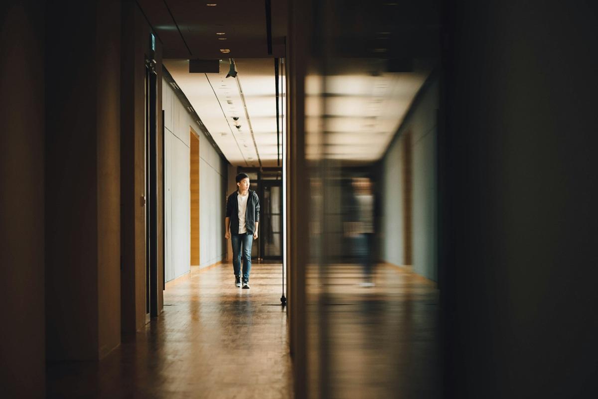 Student walking down a hallway