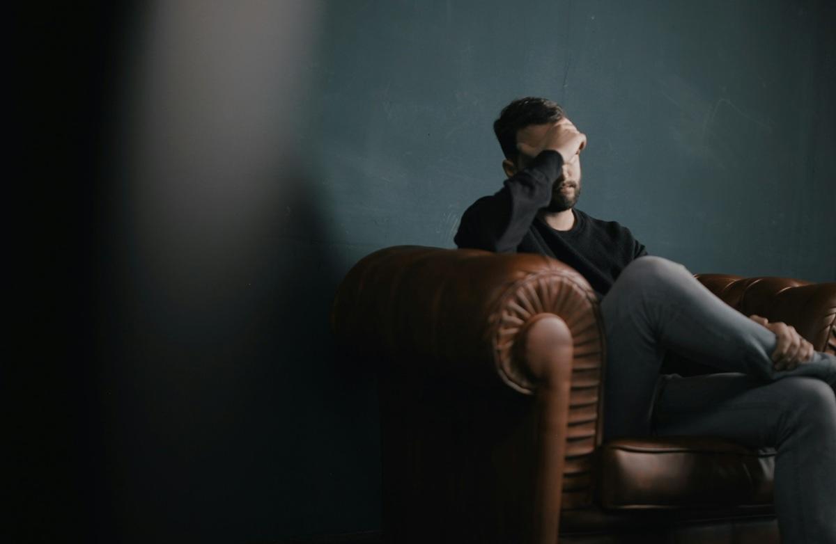 Man holding head