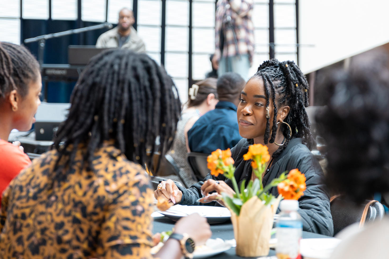 Three black women sitting around a table attending the Scarborough Charter